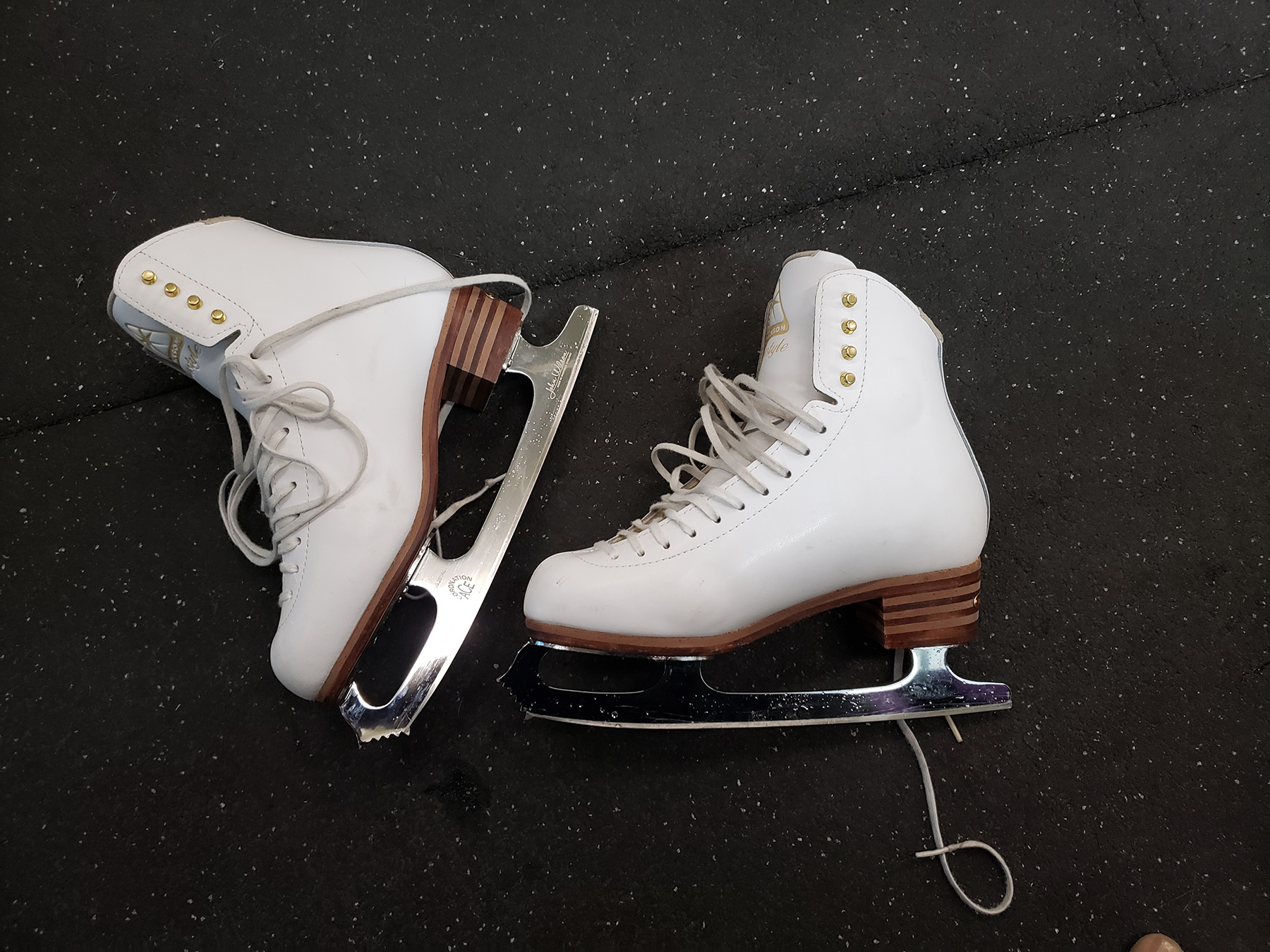 A pair of white figure skates.