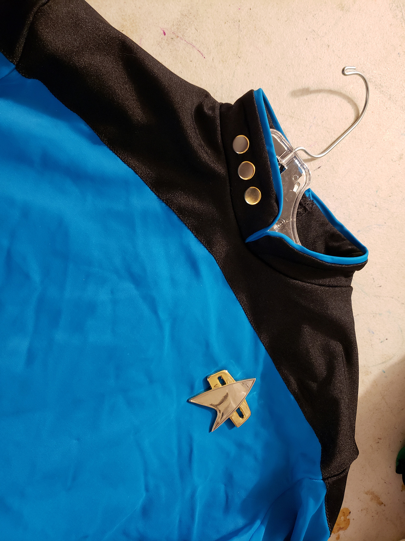 A close up view of a Blue Star Trek skating costume.