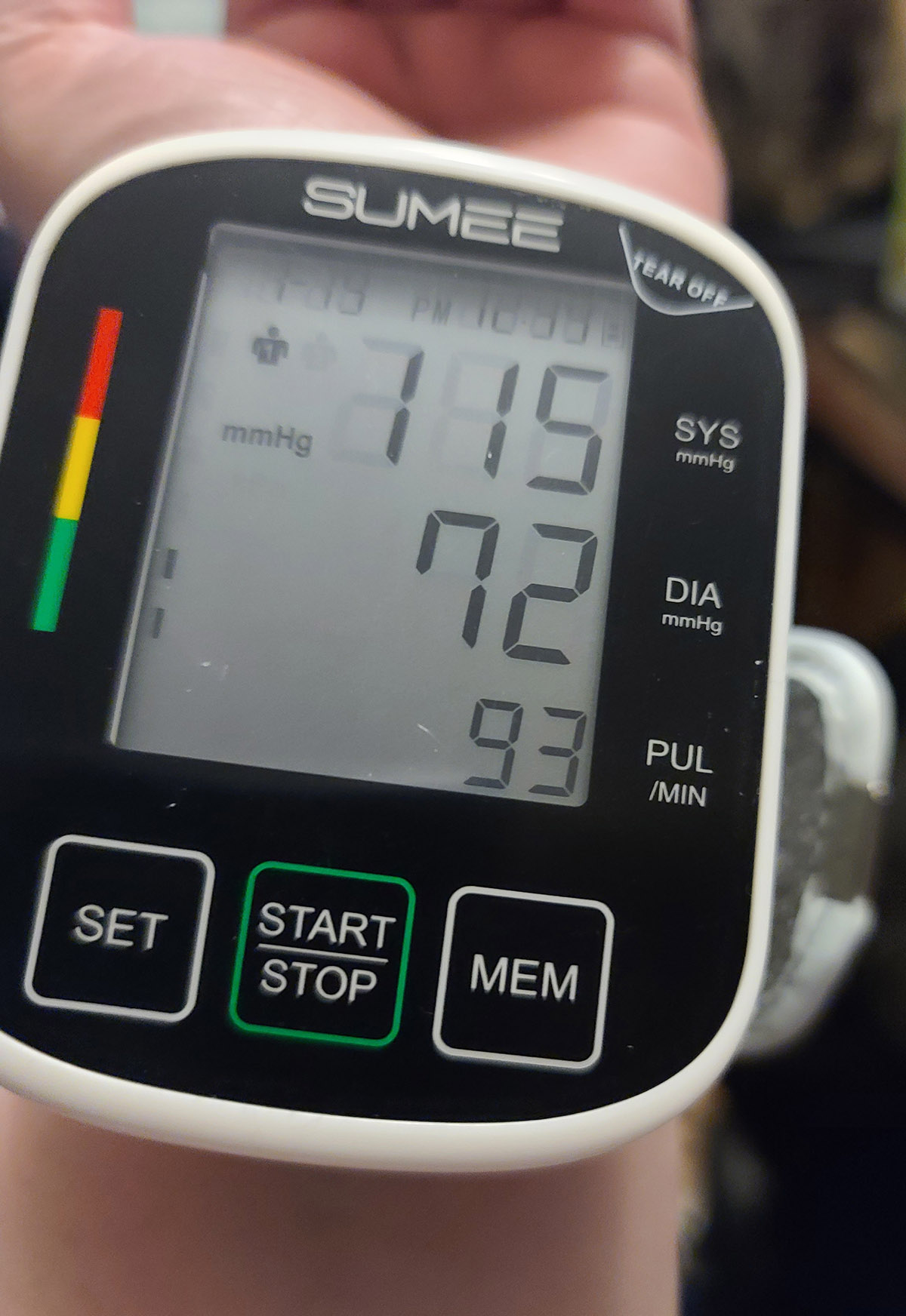 A blood pressure monitor on a woman's wrist