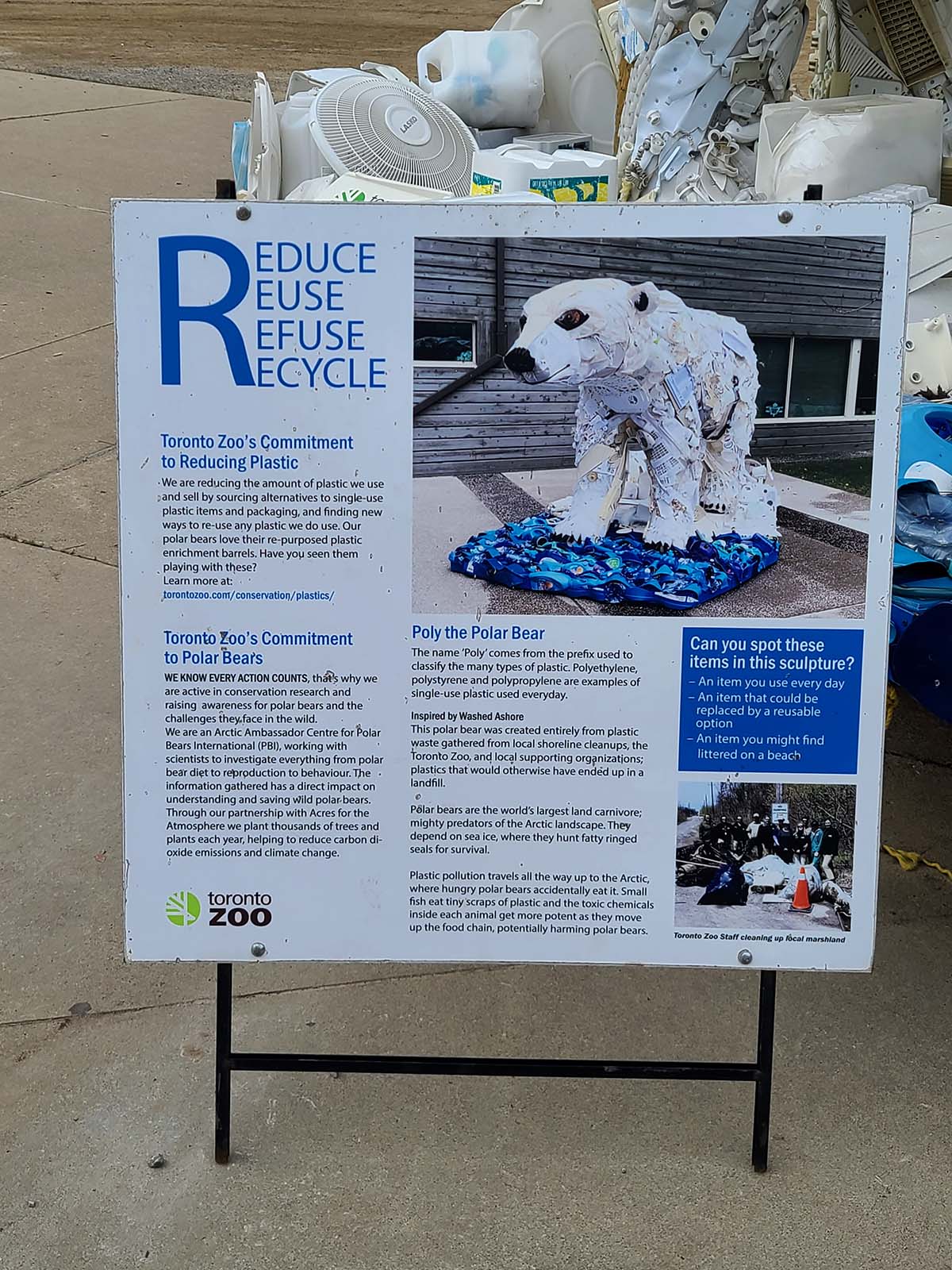 A polar bear made of recyclable items like bottles.