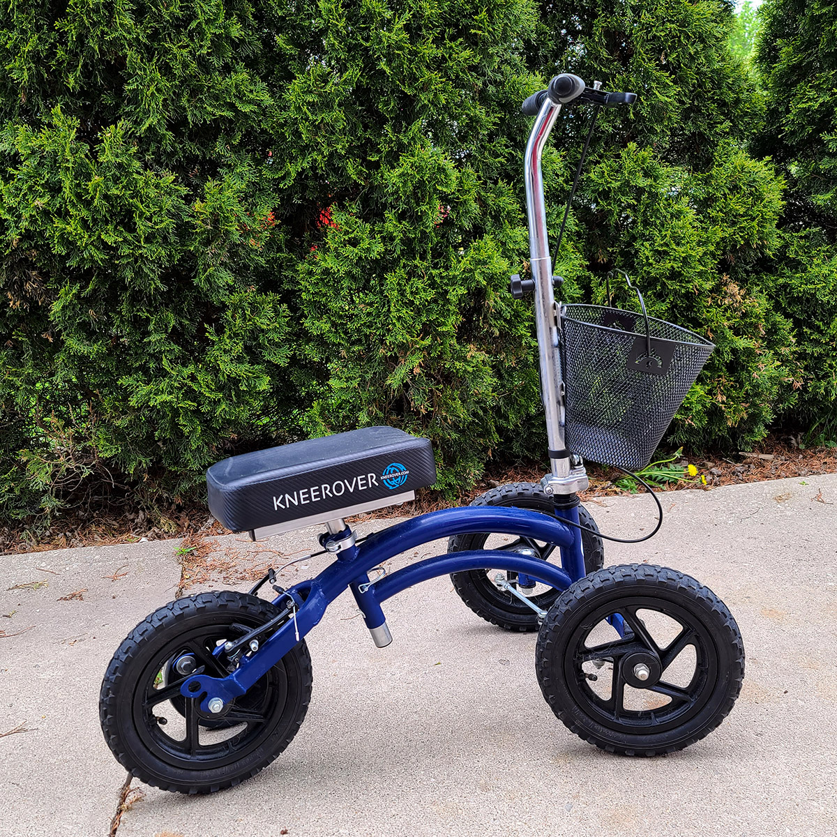 A knee scooter in a driveway.